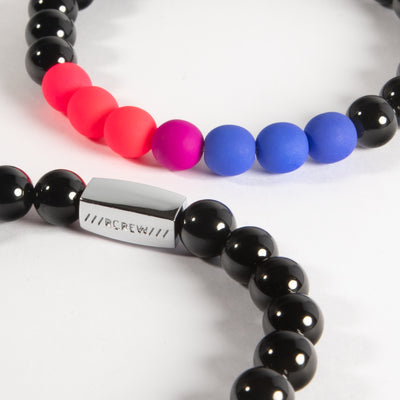 Close-up of bisexual pride bracelet showing pink, purple and blue beads and RCREW clasp, 8mm