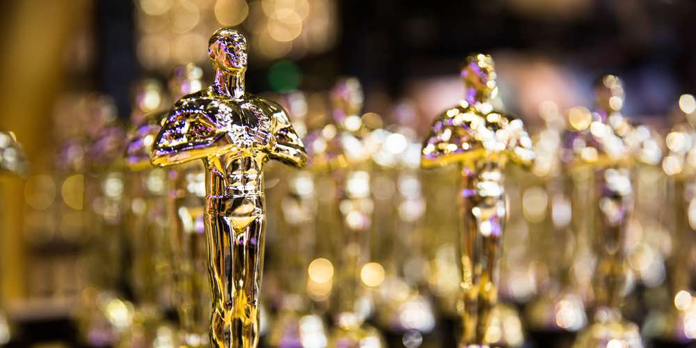 A close up picture of Oscar trophies