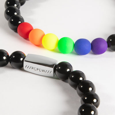 Two bold gay pride bracelets stacked together showing rainbow beads, 8mm